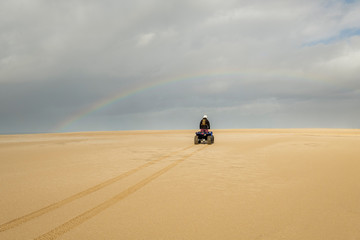 Quadbiking on sand dune, Stockton Sand Dunes, NSW, Australia