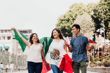 mexican guys cheering Viva Mexico on independence day in Mexico city