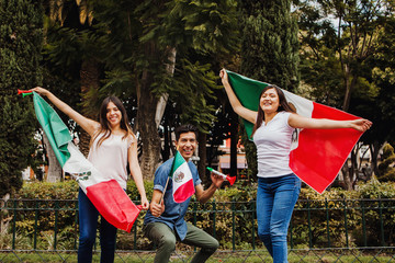 Viva Mexico, mexican guys with flag of Mexico in independence day in Mexico city