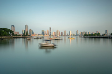 Fototapeta na wymiar Manhattan Yacht club wit jersey city on background at sunrise with long exposure