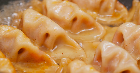 Fry meat dumpling on pan in kitchen