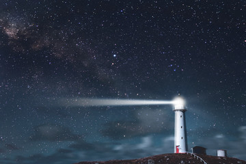 A beautiful tall white Cape Egmont Lighthouse.