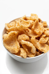 White Bowl of Fried chicharrones (pork rind)