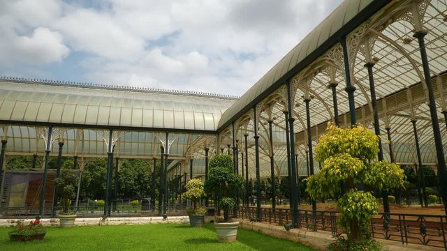 sunny day bangalore city botanical garden crystal palace exterior slow motion panorama 4k india
