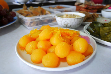 Fototapeta na wymiar Thong Yod or Candy Golden Ball cooked with egg in syrup is sweet Thai dessert.