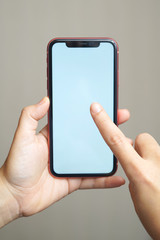 Female hand holding the iphone x