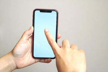Female hand holding the iphone x