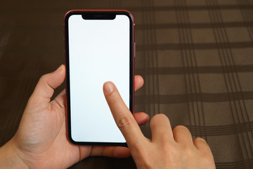 Female hand holding the iphone x