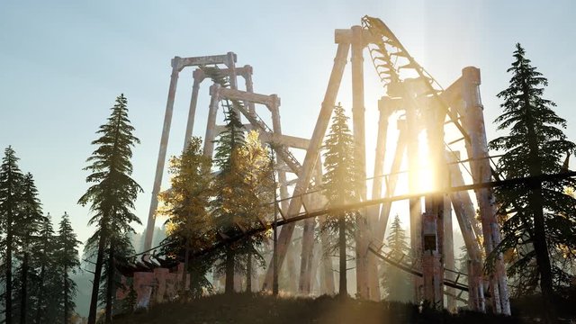 old roller coaster at sunset in forest