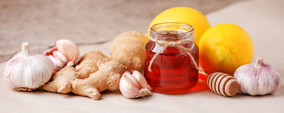 Honey, ginger, garlic and lemon, healthy products for fast recovery. Homemade antimicrobial therapy. Ingredients for healthy tea, seasonal flu remedy drink