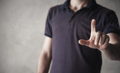 Man pointing or touching finger in screen.