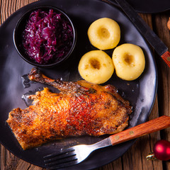 Roast goose with baked apples, red cabbage and dumplings