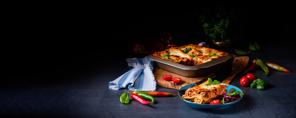 spicy lasagne with tomato sauce and basil