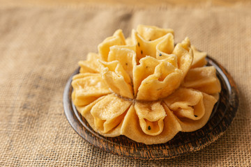 Crispy lotus blossom cookies isolated on white. Thai traditional snack. Top view. Thai homemade cookies.