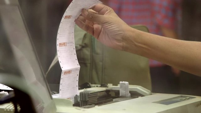 Train tickets printed on an old printer in Mumbay