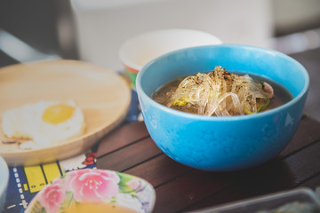Asian food : Clear glass noodle soup sprinkle pepper on top. Using Japanese vermicelli as the main raw material