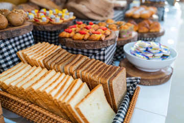 Assortment of fresh bread on table in buffet