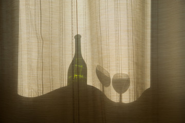 Collage on the theme of alcoholism, the curvature of space. Silhouettes of bottles and glasses...