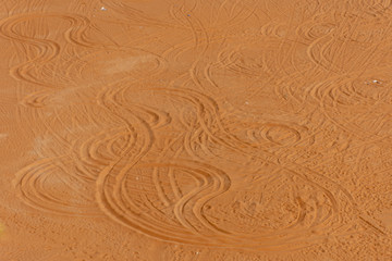 4x4 tracks in the desert sand of the United Arab Emirates in circles showing off road fun for SUVs dune bashing.