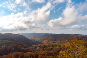 Autumn foliage scenery view, beautiful landscapes. Fall is full of magnificent colours. Entire mountain and valley is bathed in different hues of red, orange and golden colors background