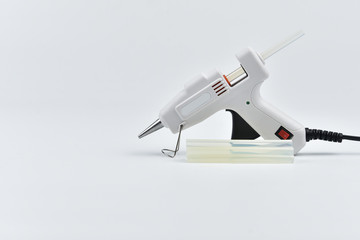 Hot melt glue gun on white background