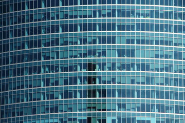 Close up Wall of a contemporary office building with mirrored Windows, business center, windows of modern building texture for background