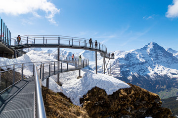 Traveller are resting and photograph on sky cliff walk at First peak of Alps mountain Grindelwald...