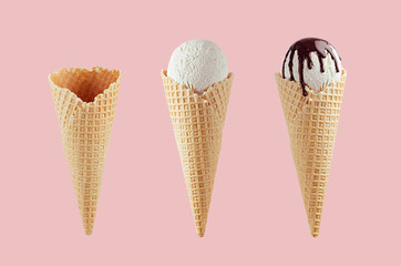 Set of different ice cream cones in waffle cone - empty, white ice cream, with chocolate sauce on  pink background.