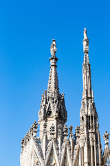 Fototapeta na wymiar Aerial view of statue from Milan Duomo roof terrace , Italy
