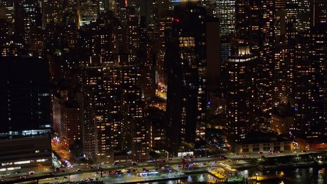 NYC New York Aerial v112 Panning nighttime birdseye detail of Murray Hill, East River riverfront with FDR traffic - October 2017