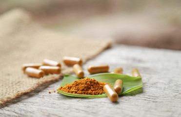 Herbal capsules from organic turmeric herb for health care eating 