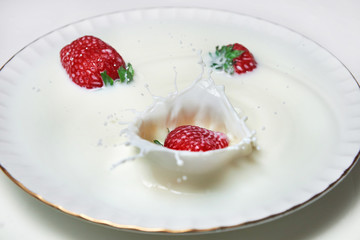 dessert with strawberries and milk cream on the plate