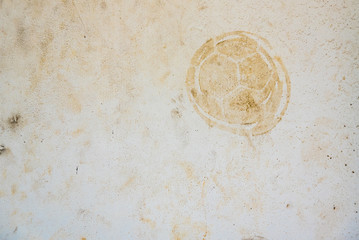 Football print on cement background,soccer slough on wall.