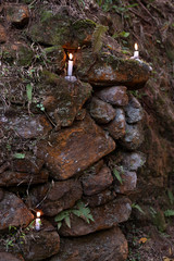 Some candles among the rocks