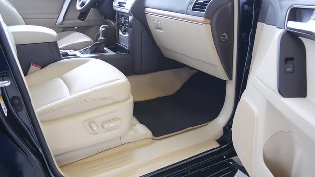 Luxury SUV car interior, dashboard with leather seats and upholstery