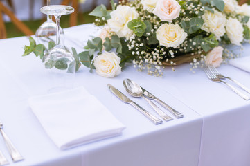 Table setting at a luxury wedding and Beautiful flowers on the table.