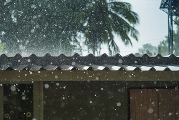 Storm rain on the roof of the house.