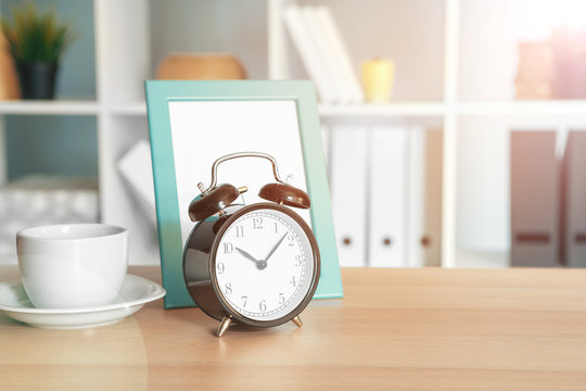Office interior details with alarm clock and stationery items