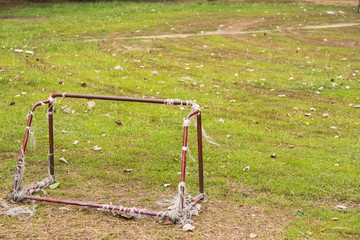 Old rust football goal abandoned soccer goal field located on the ground.