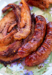 Unhealthy but tasty grilled sausages and meat