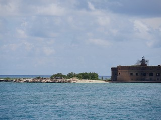 Fototapeta premium Beach area at the back side of Fort Jefferson, a historic military fortress at the Dry Tortugas National Park, Florida.