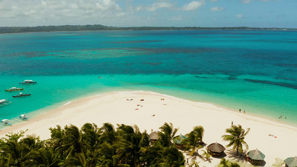 Sand beach and tropical islands, palm trees by atoll with coral reef, top view.Daco island, Philippines. Summer and travel vacation concept
