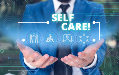Handwriting text Self Care. Conceptual photo practice of taking action preserve or improve ones own health Male human wear formal work suit presenting presentation using smart device