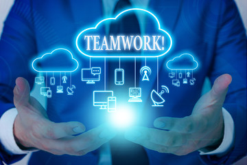 Word writing text Teamwork. Business photo showcasing combined action of group especially when effective and efficient Male human wear formal work suit presenting presentation using smart device