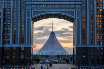 Nur-Sultan, Kazakhstan, August 2019, Tall buildings and attractions at dusk.