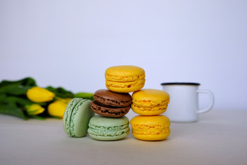 Stack of colorful french macarons of different flavors. 