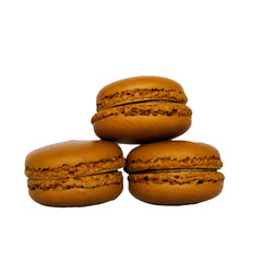 Stack of fresh delicious  caramel french macarons isolated on white background. 