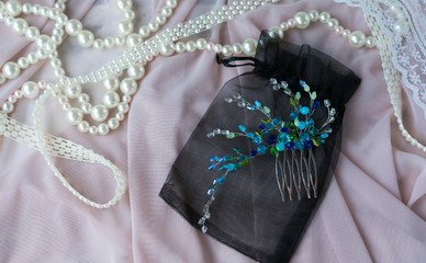 Wedding background with pearls and hair accessories on pink background