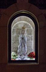 Fototapeta premium The statue of the Virgin Mary on the street in the Old City of Jerusalem in Israel