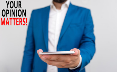 Word writing text Your Opinion Matters. Business photo showcasing show you do not agree with something that just been said Business concept with man holding mobile phone with touch screen